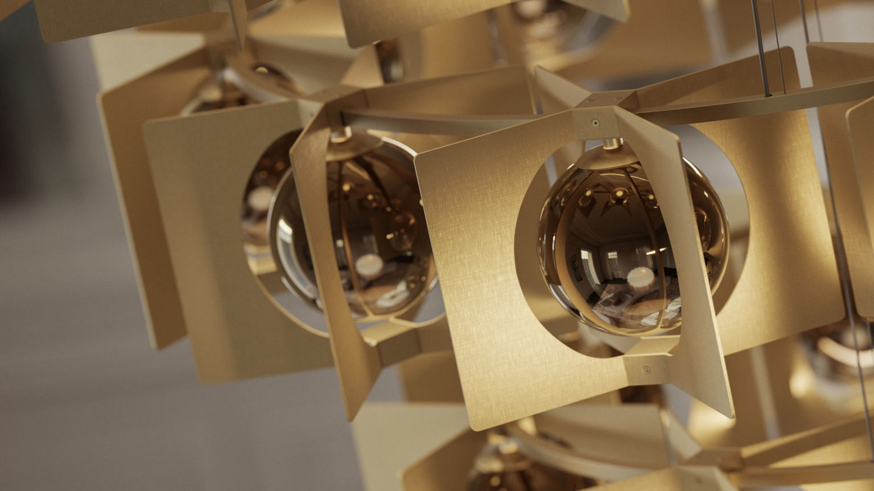 Dettaglio lampada Girouette Masiero con sfere in vetro borosilicato e lamine dorate