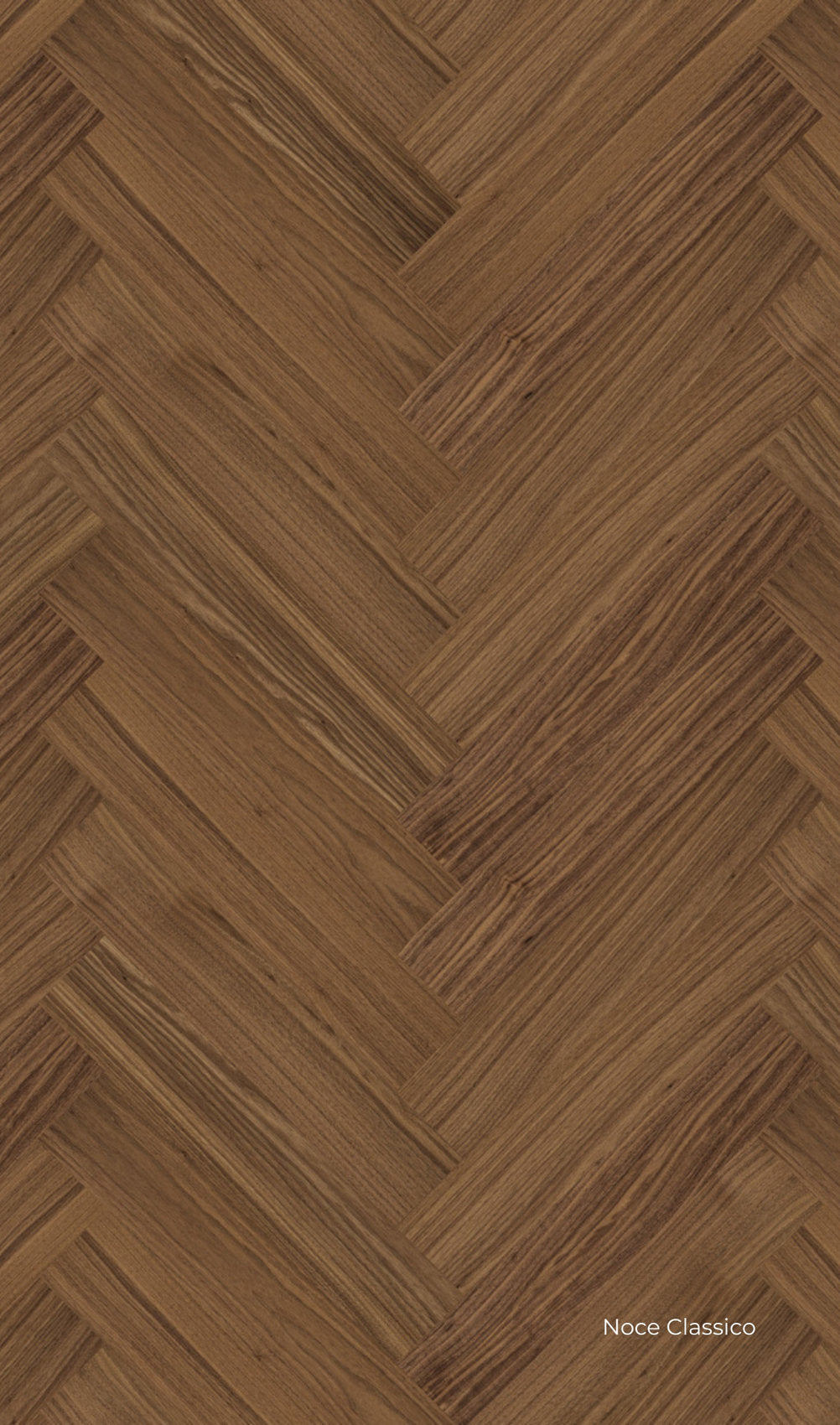 Dettaglio di pavimento Lumbertech S700 in finitura Noce Reale, posa a spina italiana con venature calde e variazioni tonali evidenti.