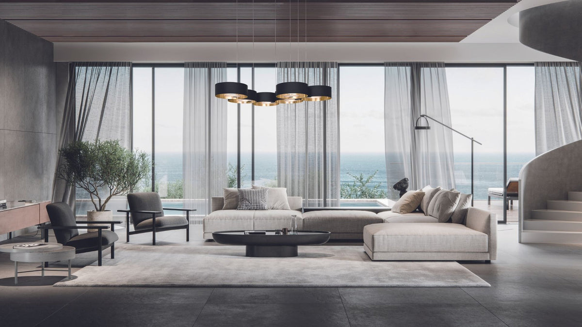 Lampadario a sospensione Sound OR6 Masiero, sei elementi circolari neri e oro in soggiorno moderno.