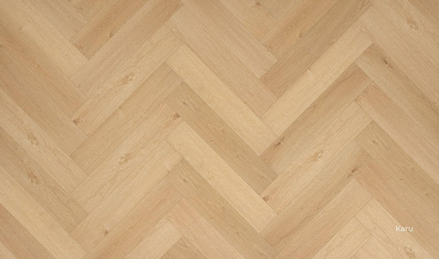 Pavimento SPC Flow posa a spina italiana, effetto legno caldo, disegno a incastro in primo piano