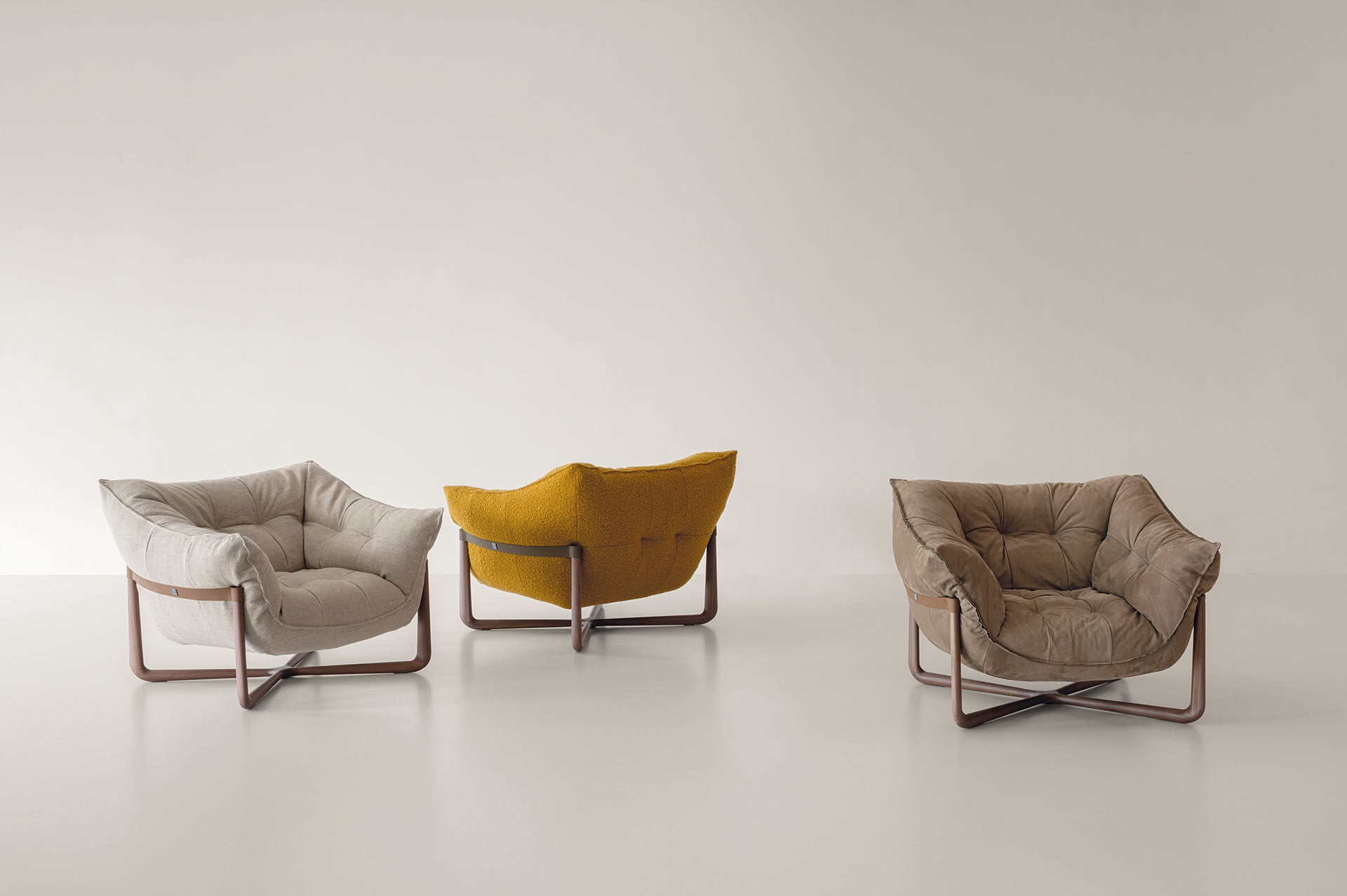 Tre poltrone Donald Cierre1972 in tessuti e finiture diverse, design Marco Fumagalli, collezione 2025