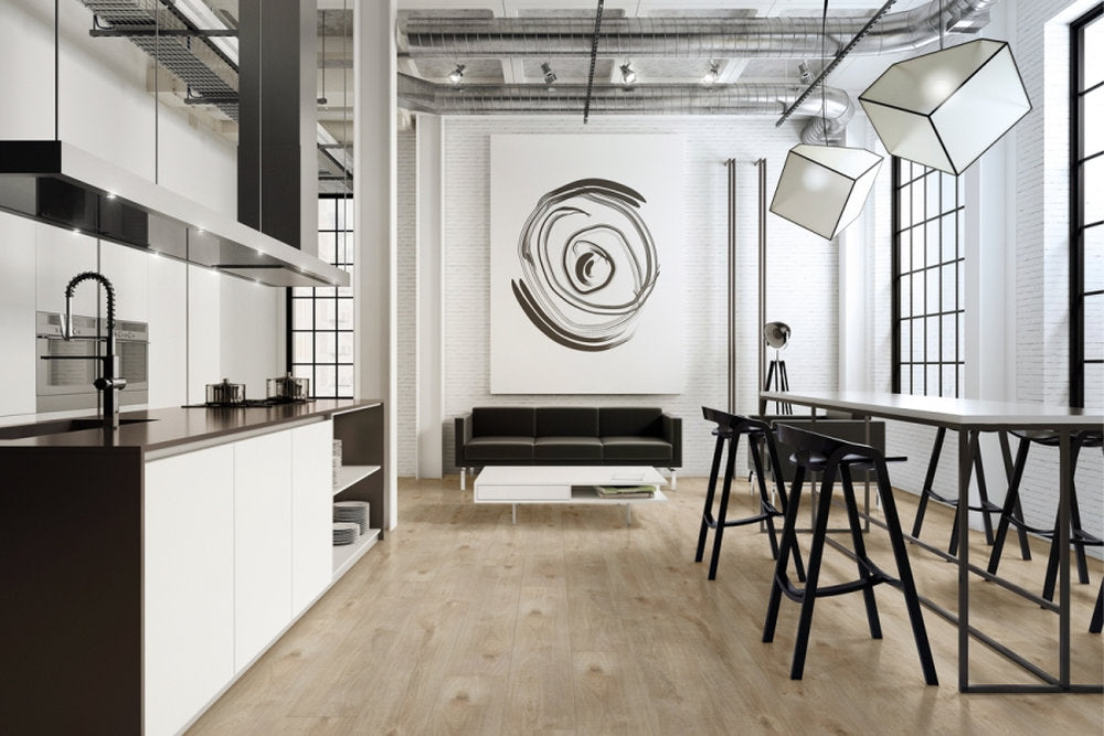 Zona cucina e living con pavimento SPC Starkc Skema finitura Braga, effetto legno chiaro e posa uniforme