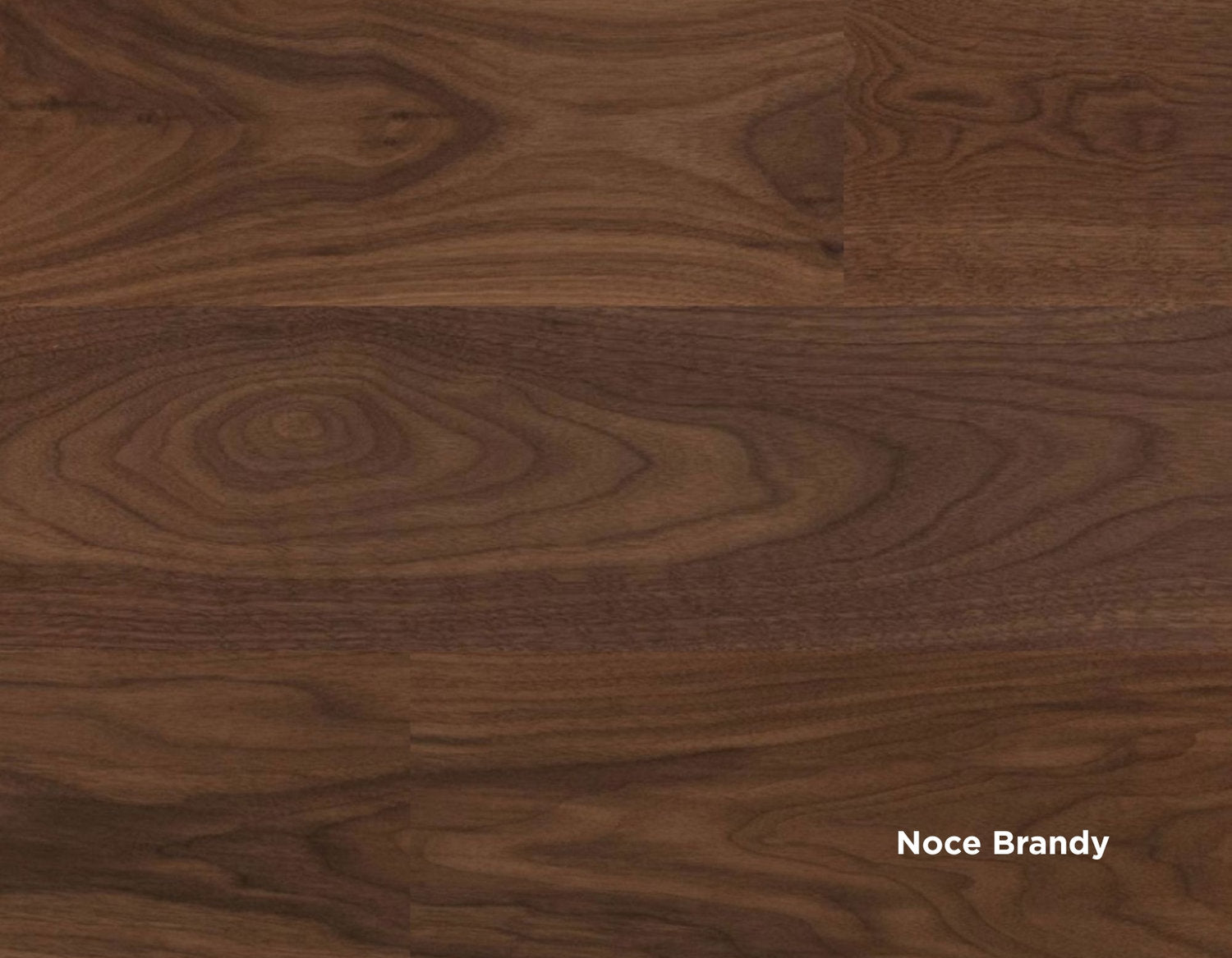 Dettaglio superficie pavimento SPC Skema Star Wood, finitura Noce Brandy, con venature marcate e tonalità calda e profonda