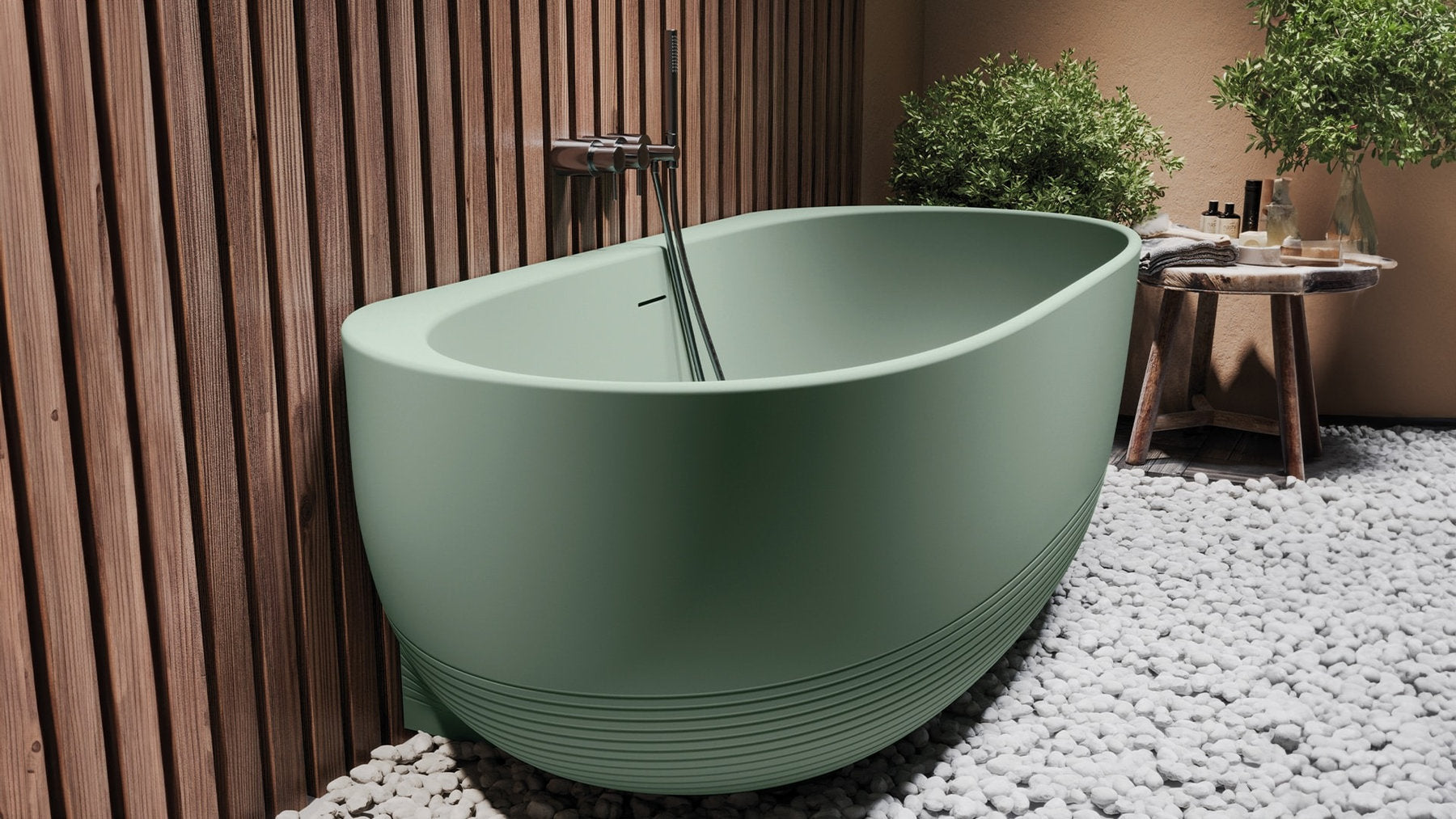 Vasca Aura freestanding addossata al muro, verde opaco, rubinetteria a parete e rivestimento legno