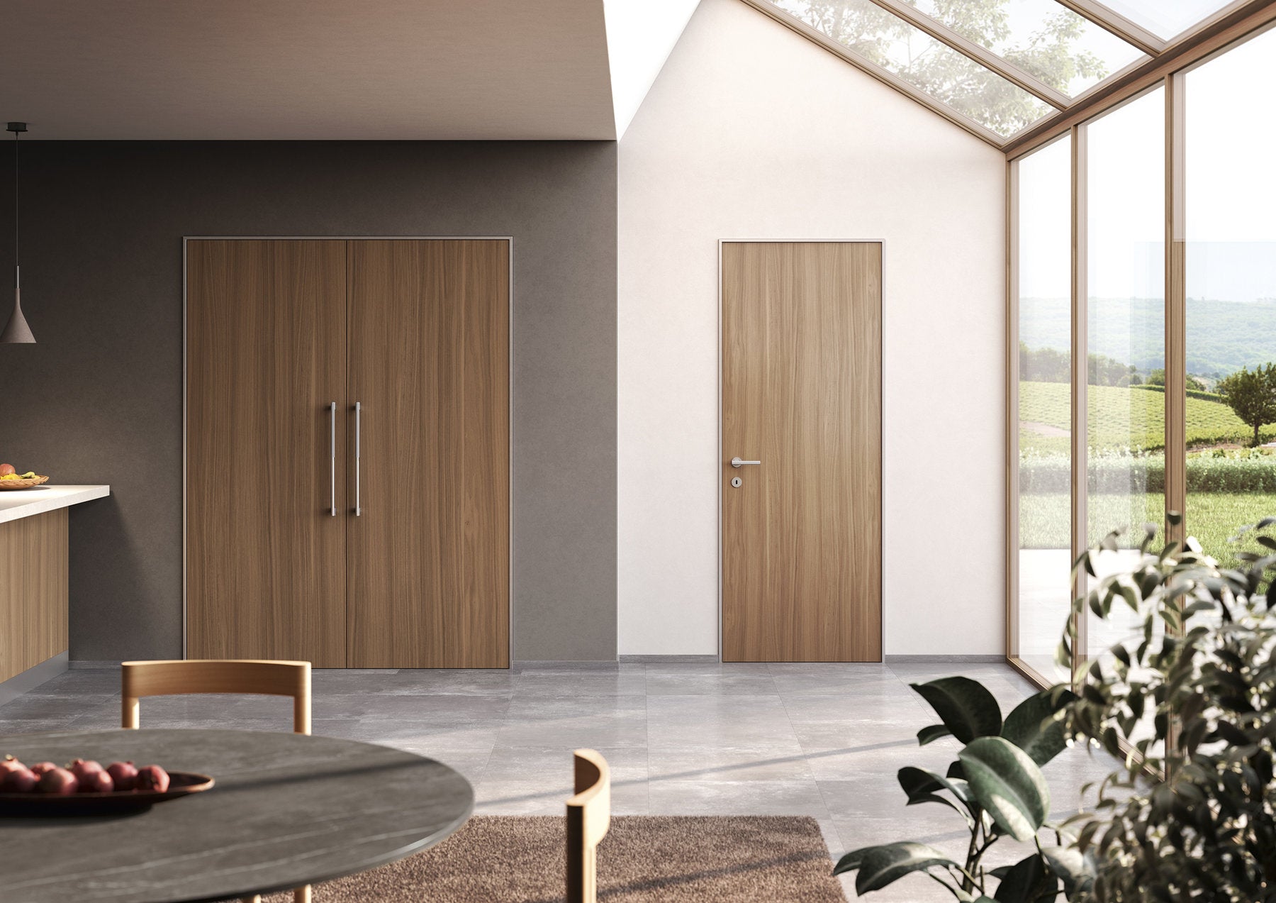 Maniglia Ento Stelo ambientata su porte in legno in interno contemporaneo