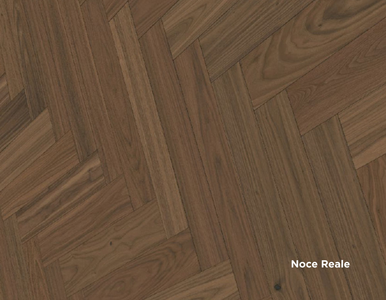 Dettaglio di pavimento Lumbertech S700 in finitura Noce Reale, posa a spina italiana con venature calde e variazioni tonali evidenti.