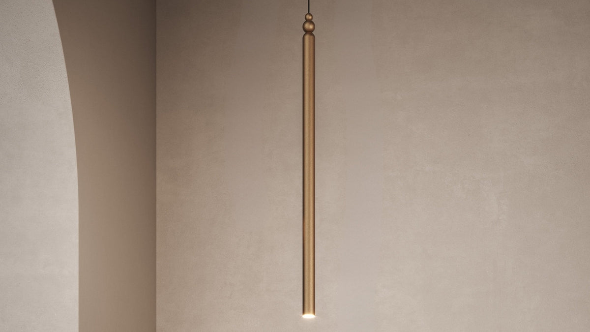 Lampada a sospensione LED Serica Masiero in metallo finitura bronzo, dettaglio del corpo cilindrico verticale