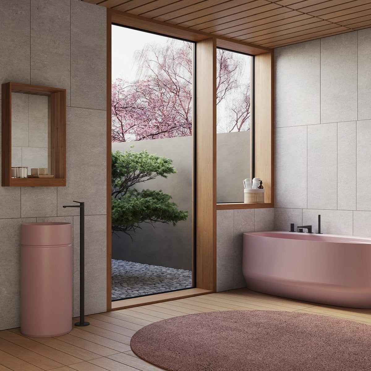 Bagno minimal giapponese con vasca IKI rosa angolare, giardino zen e lavabo freestanding